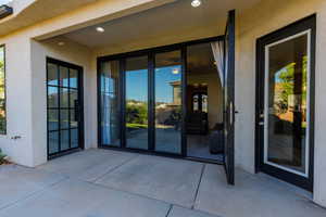 Back patio entrance with accordion door to combine indoor and outdoor living.