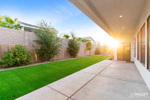 Fenced backyard featuring a patio