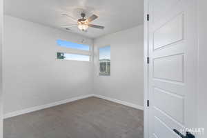 Bedroom with light carpet and a ceiling fan