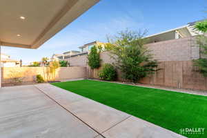 Fenced backyard featuring a patio