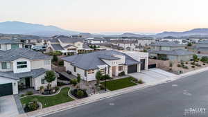 Aerial perspective of suburban area with a mountain backdrop