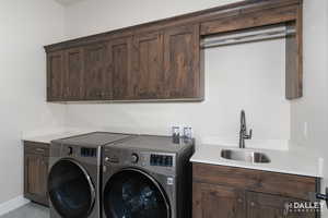 Laundry room with cabinet space and separate washer and dryer