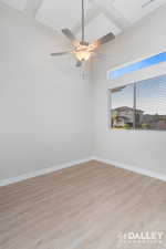 Bedroom/Front Office featuring light wood-style flooring and a ceiling fan