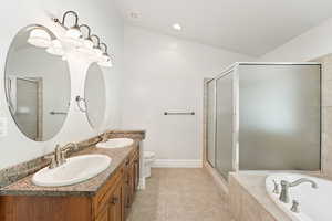 Full bathroom featuring a shower stall, a garden tub, light tile patterned floors, double vanity, and recessed lighting