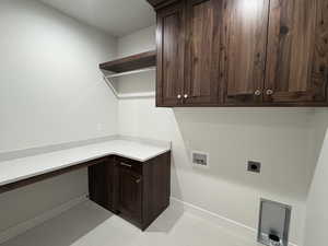 Laundry area featuring hookup for a washing machine, hookup for an electric dryer, and cabinet space