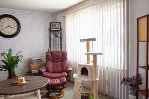 Living area featuring wallpapered walls