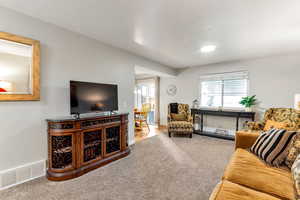 Living area with carpet flooring