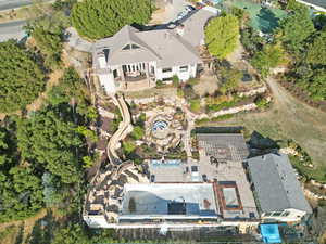 Aerial view of property's location featuring a pool area
