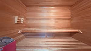 Sauna / steam room with wooden walls and wooden ceiling