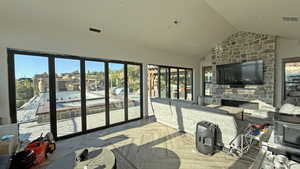 Sunroom / solarium with lofted ceiling and healthy amount of natural light