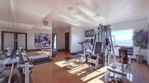 Workout room featuring baseboards