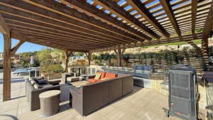 View of patio featuring area for grilling