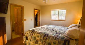 Bedroom featuring wood finished floors and ceiling fan