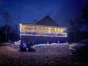 Snow covered house with a deck