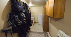 Washroom with baseboards and washer / clothes dryer