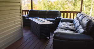 Deck with an outdoor living space with a fire pit