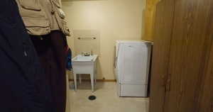 Laundry room featuring washer / clothes dryer and baseboards