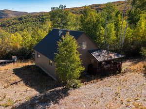 View from above of property with a forest