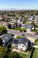 Aerial perspective of suburban area featuring a mountain backdrop