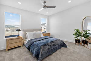 Carpeted bedroom with recessed lighting and ceiling fan