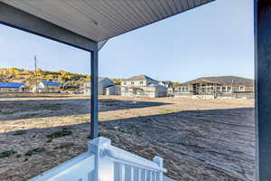 View of yard featuring a residential view and a patio