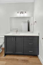 Bathroom featuring vanity and light wood-style flooring
