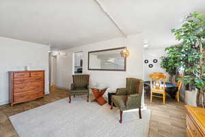 Living area featuring light wood-type flooring and baseboards