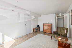 Sitting room with light wood finished floors and baseboards