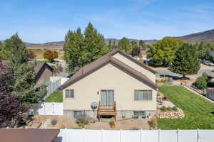 Aerial of back of home featuring balcony