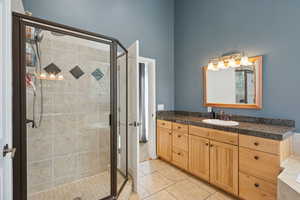 En-Suite Primary Bath with Separate Tub and Shower, Dual Vanity, Granite Counters, Water Closet and Walk-in Closet