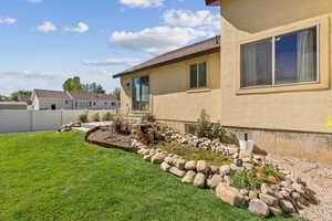 Side Yard with Lush Grass and Water Feature/Pond