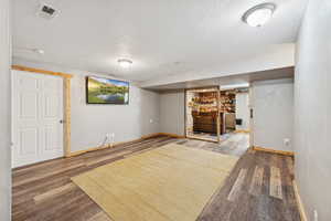 Lower Level Family Room. LVT Flooring, Separate Bar/Dining/Lounge. Large Storage Closet