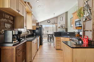 Kitchen with Alder Wood Cabinets, Granite Counters, Stainless Counters, Bamboo Floors