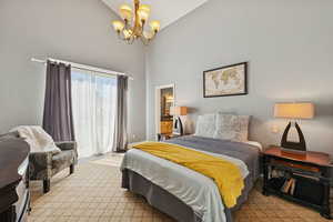 Primary Bedroom with Vaulted Ceiling, Sliding Glass Doors to Balcony, En-Suite Bath with Separate Tub and Shower, Walk in Closet.