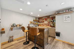 Wet Bar and Lounge with Dining Space, Fridge, LVT Flooring and Barn DoorPublic