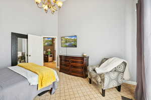 Primary Bedroom with Vaulted Ceiling, Sliding Glass Doors to Balcony, En-Suite Bath with Separate Tub and Shower, Walk in Closet.