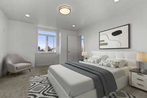 Bedroom featuring light carpet and recessed lighting