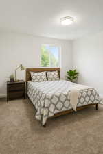 Carpeted bedroom featuring baseboards