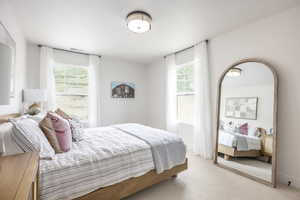 Carpeted bedroom with baseboards