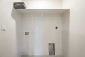 Laundry area with hookup for a washing machine and electric dryer hookup