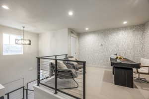 Office with recessed lighting, light colored carpet, a chandelier, and wallpapered walls