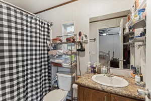 Full bathroom featuring vanity, a shower with curtain, connected bathroom, and ceiling fan