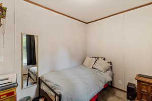 Bedroom featuring crown molding