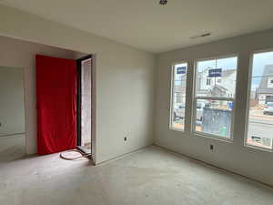 Unfurnished dining area featuring unfinished concrete flooring