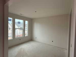 Spare room featuring concrete flooring
