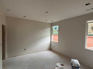 Unfurnished room featuring concrete floors