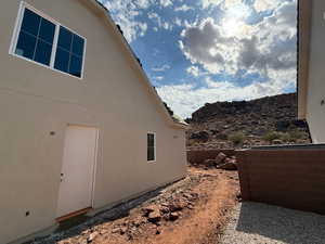 View of property exterior with stucco siding
