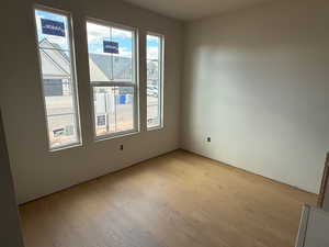 Empty room with light wood-type flooring