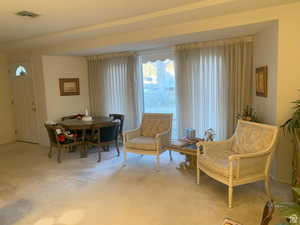 Living area featuring carpet flooring