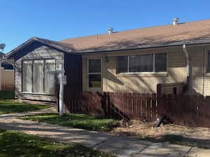 View of front of house featuring brick siding